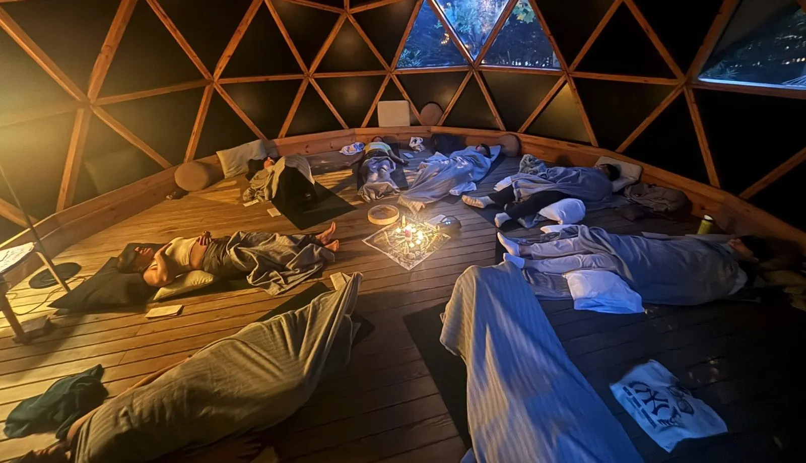Group breathwork session inside a dome