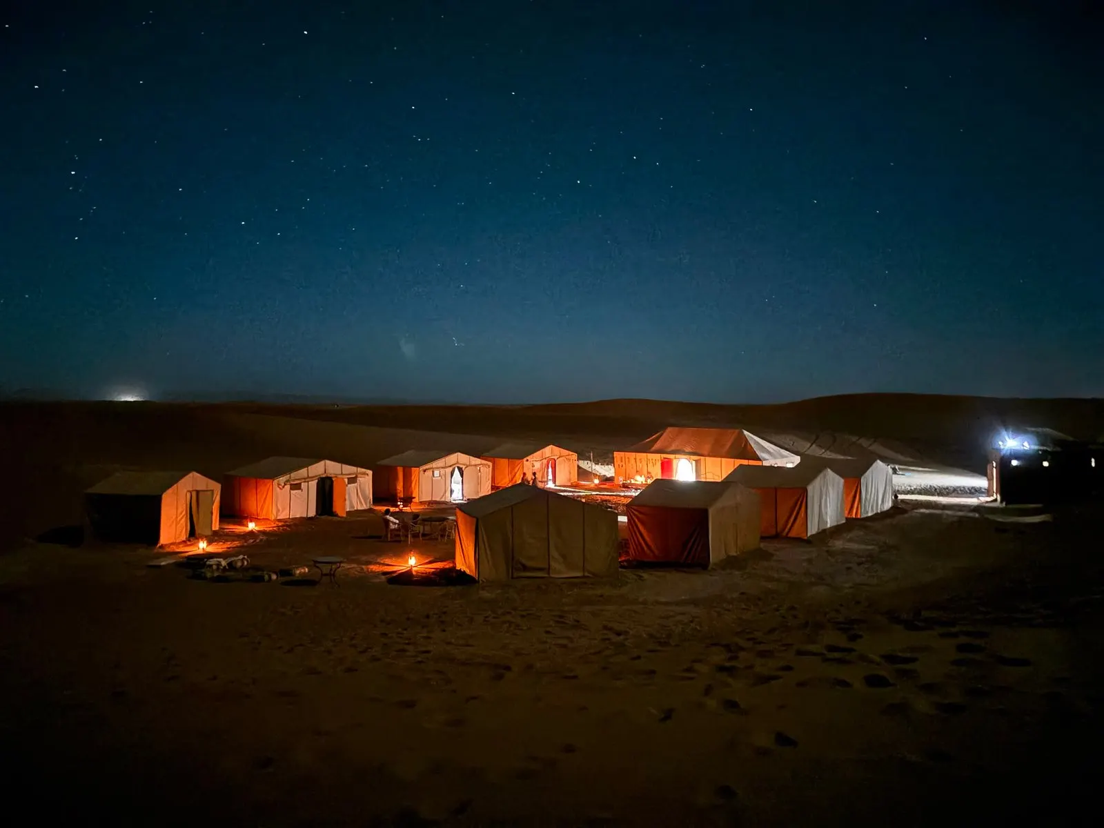 EMME Desert Retreat camp at night under the stars